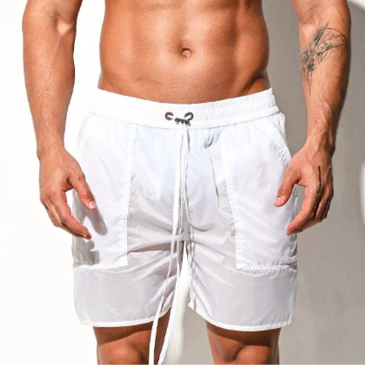 a sexy man in white Men’s Cellblock Sheen Swim Short – pridevoyageshop.com – gay men’s sexy swim briefs, trunks, board shorts, and bikinis