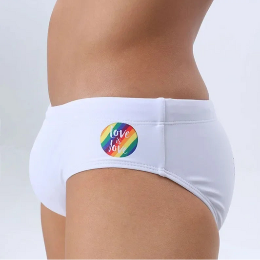 a sexy man in white Men’s Pride Rainbow Print Sexy Swim Briefs - pridevoyageshop.com - gay men’s sexy swim briefs, trunks, board shorts, and bikinis