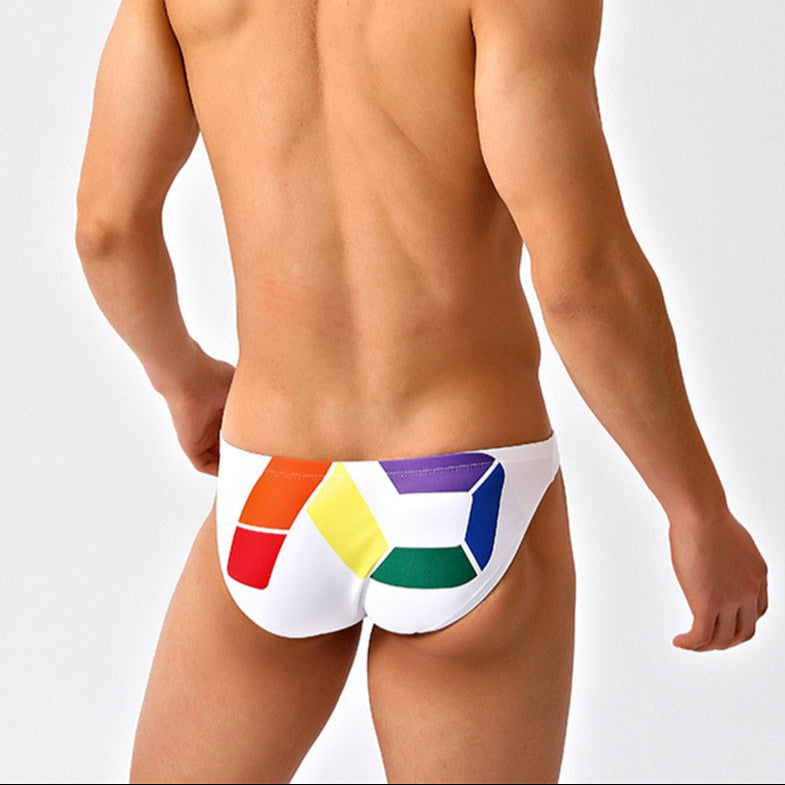 a sexy man in white Men’s Queer Grid Rainbow Pride Swim Briefs - pridevoyageshop.com - gay men’s sexy swim briefs, trunks, board shorts, and bikinis