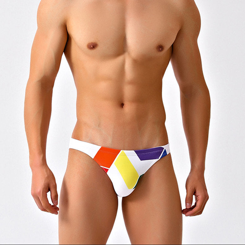 a sexy man in white Men’s Queer Grid Rainbow Pride Swim Briefs - pridevoyageshop.com - gay men’s sexy swim briefs, trunks, board shorts, and bikinis