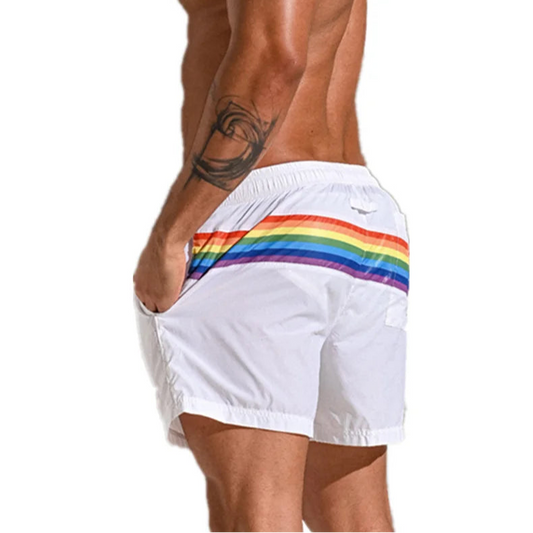 a sexy man in white Men’s Werk the Rainbow Volley Pride Board Shorts – pridevoyageshop.com – gay men’s sexy swim briefs, trunks, board shorts, and bikinis