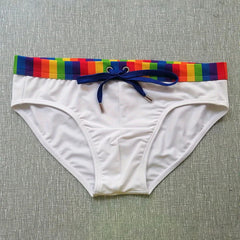 white Men’s Pride Patrol Rainbow Band Swim Briefs - pridevoyageshop.com - gay men’s sexy swim briefs, trunks, board shorts, and bikinis