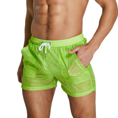 sexy gay man in green Gay Beachwear | Men's Transparent Board Shorts with Pockets - pridevoyageshop.com - gay men’s underwear and swimwear