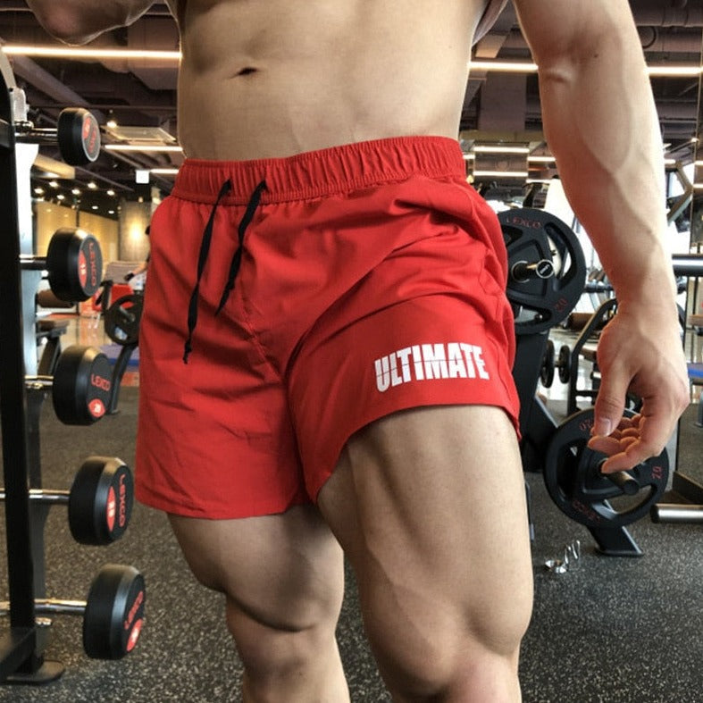 a gay hunk in red Mens Ultra Power Training Shorts - gay gym shorts from pridevoyageshop