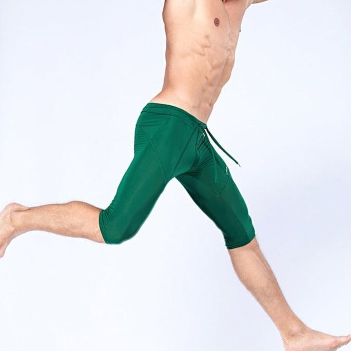 sexy gay man in dark green Gay Leggings | Men's Sexy 3/4 Compression Sport Leggings - pridevoyageshop.com - gay men’s underwear and activewear