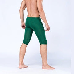 sexy gay man in dark green Gay Leggings | Men's Sexy 3/4 Compression Sport Leggings - pridevoyageshop.com - gay men’s underwear and activewear