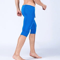 sexy gay man in blue Gay Leggings | Men's Sexy 3/4 Compression Sport Leggings - pridevoyageshop.com - gay men’s underwear and activewear