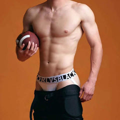 a hot gay man in white ORLVS Bold Jockstrap - pridevoyageshop.com - gay men’s underwear and swimwear