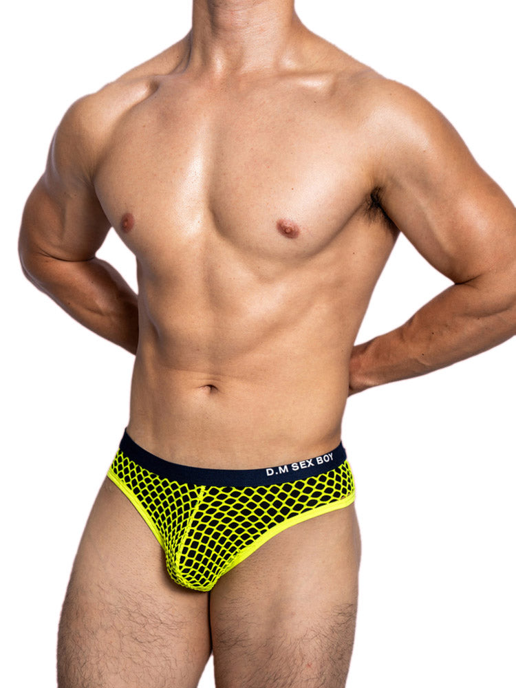 a sexy gay man in neon yellow DM Sexy Boy Fishnet Briefs - pridevoyageshop.com - gay men’s underwear and swimwear