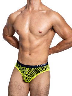 a sexy gay man in neon yellow DM Sexy Boy Fishnet Briefs - pridevoyageshop.com - gay men’s underwear and swimwear