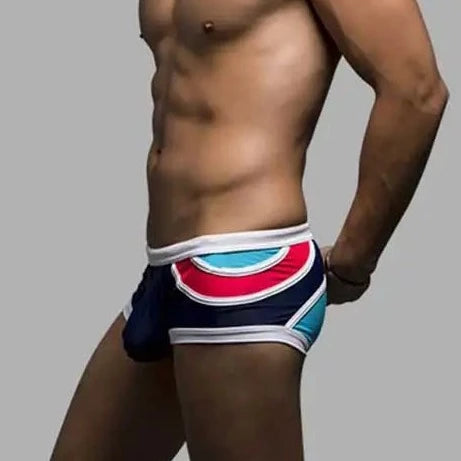 a hot gay man in Men's Spice Colored Swim Trunks - pridevoyageshop.com - gay men’s underwear and swimwear