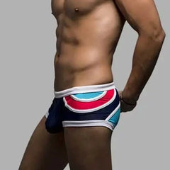 a hot gay man in Men's Spice Colored Swim Trunks - pridevoyageshop.com - gay men’s underwear and swimwear