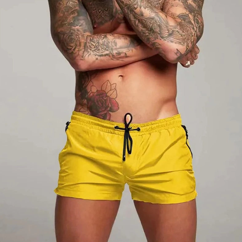 a hot gay man in yellow Men's Solid Color Pocketed Running Shorts - pridevoyageshop.com - gay men’s underwear and swimwear