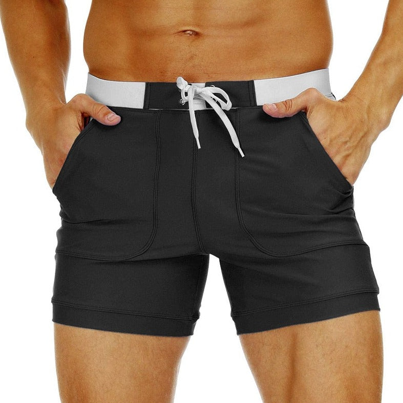 hot gay man in black Gay Swimwear & Beachwear | Drawstring Boxer Swim Trunks - pridevoyageshop.com - gay men’s underwear and swimwear