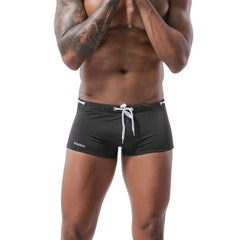 hot gay man in black Gay Swimwear & Beachwear | Men's Bowtie Tight Swim Trunks - pridevoyageshop.com - gay men’s underwear and swimwear