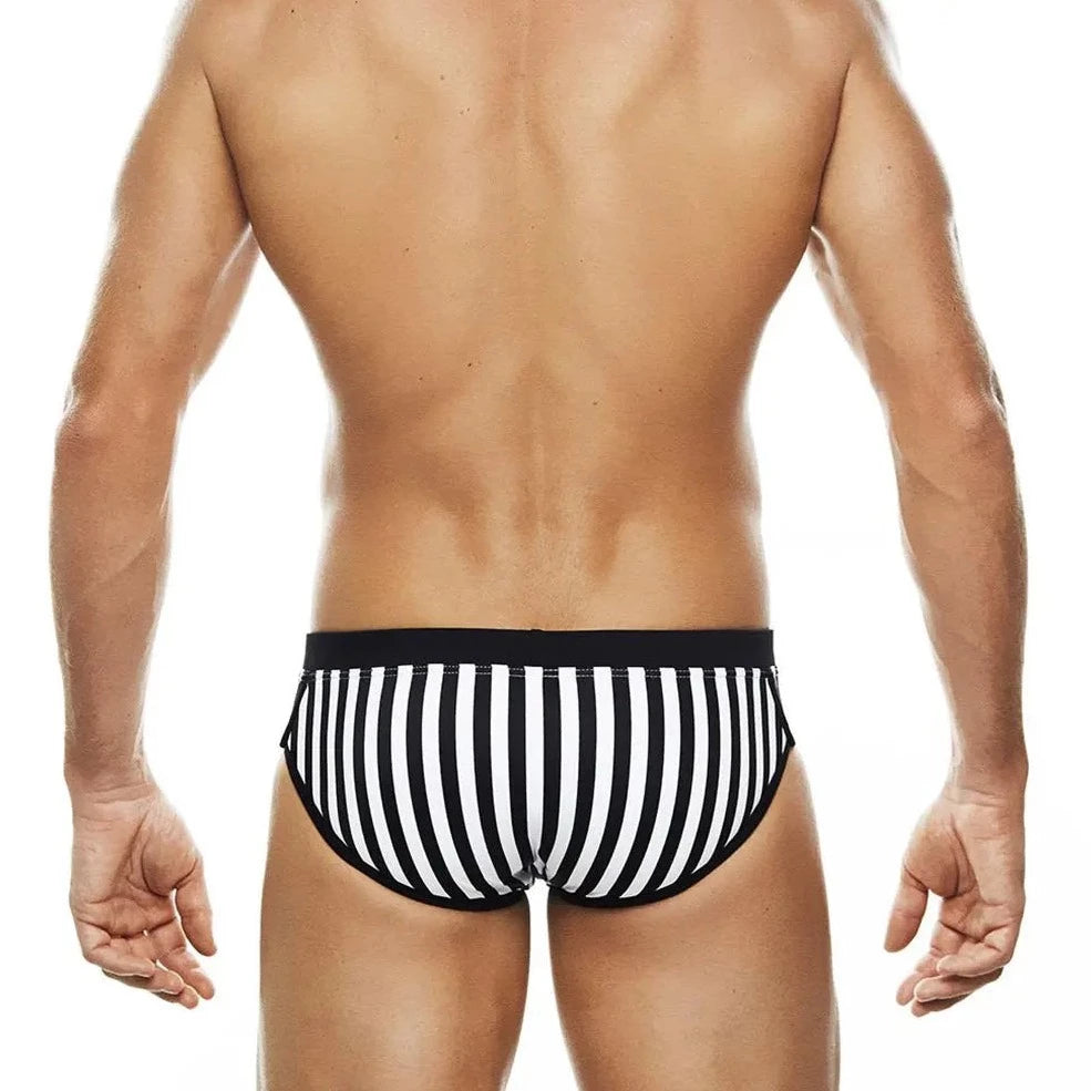 a sexy gay man in Wild Zebra's Stripes Swim Briefs - pridevoyageshop.com - gay men’s underwear and swimwear