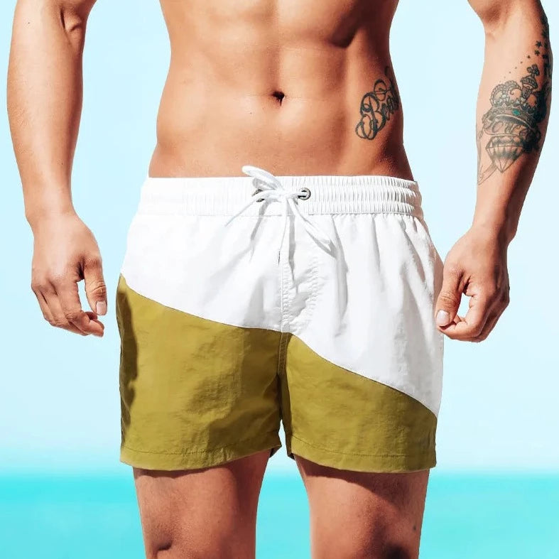 a hot guy in white Tidal Charm Two Toned Board Shorts - pridevoyageshop.com - gay men’s underwear and swimwear