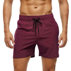 a hot gay man in wine red Solid Color Pocketed Board Shorts - pridevoyageshop.com - gay men’s underwear and swimwear
