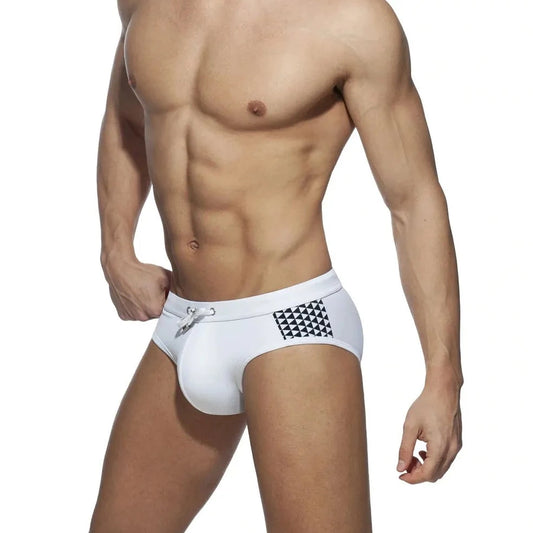 a sexy gay man in white Monochrome Matrix Swim Briefs - pridevoyageshop.com - gay men’s underwear and swimwear