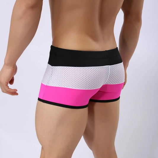 a hot gay man in Black + White + Pink Men's Tricolor Mesh Swim Trunks - pridevoyageshop.com - gay men’s underwear and swimwear