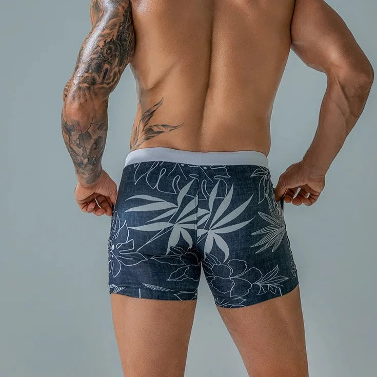 a hot gay man in blue Wild Island Flirt Swim Trunks - pridevoyageshop.com - gay men’s underwear and swimwear