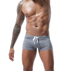 hot gay man in gray Gay Swimwear & Beachwear | Men's Bowtie Tight Swim Trunks - pridevoyageshop.com - gay men’s underwear and swimwear