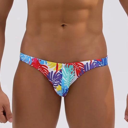 a hot gay man in Men's Tropical Leaves Skinny Swim Briefs - pridevoyageshop.com - gay men’s underwear and swimwear