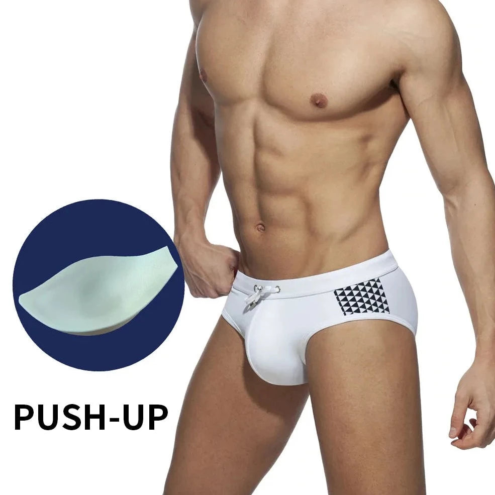 a sexy gay man in white Monochrome Matrix Swim Briefs - pridevoyageshop.com - gay men’s underwear and swimwear