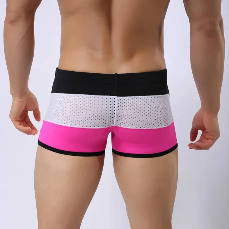 a hot gay man in Black + White + Pink Men's Tricolor Mesh Swim Trunks - pridevoyageshop.com - gay men’s underwear and swimwear