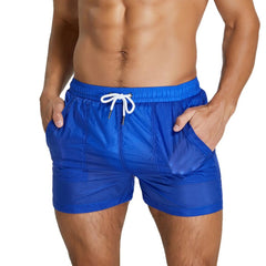 sexy gay man in blue Gay Beachwear | Men's Transparent Board Shorts with Pockets - pridevoyageshop.com - gay men’s underwear and swimwear