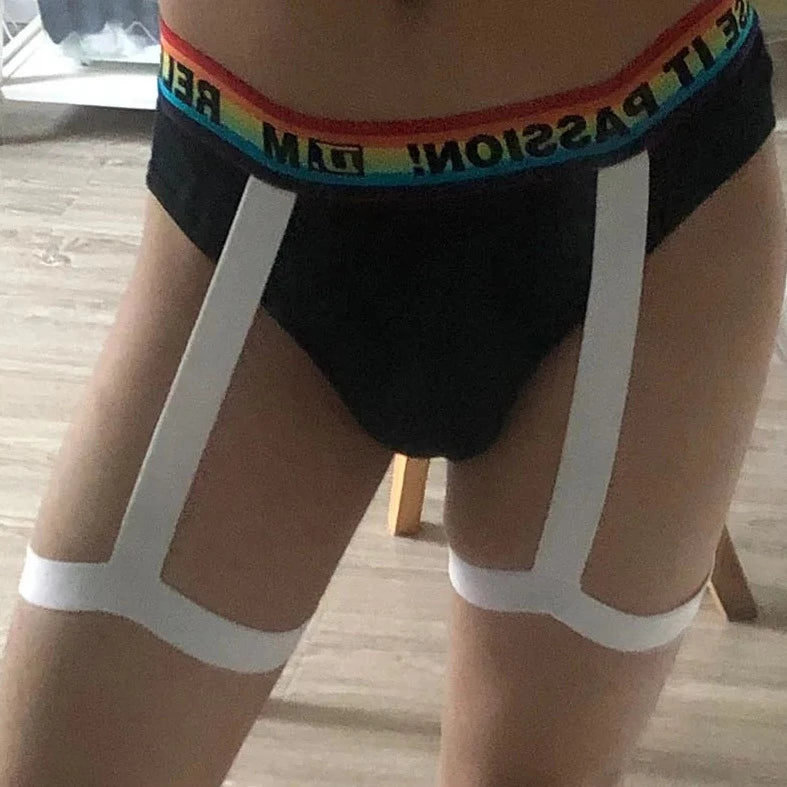 gay man in black DM Pride Rainbow Passion Garter Briefs - pridevoyageshop.com - gay men’s underwear and swimwear