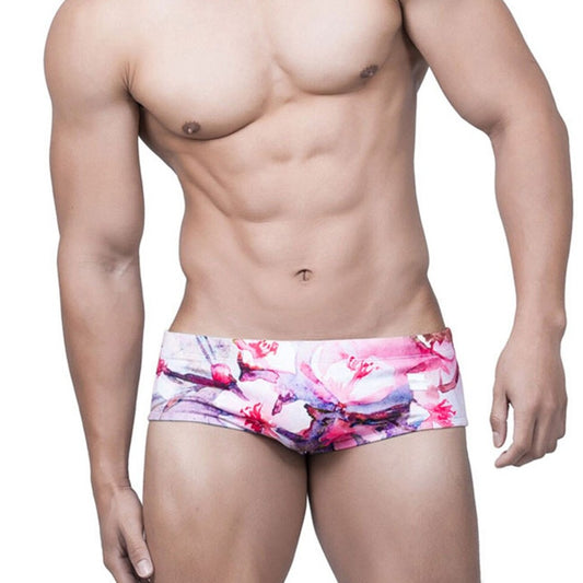 sexy gay man in Gay Swimwear | Pink Watercolor Swim Briefs- pridevoyageshop.com - gay men’s underwear and swimwear