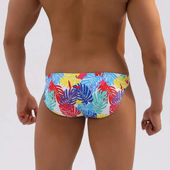 a hot gay man in Men's Tropical Leaves Skinny Swim Briefs - pridevoyageshop.com - gay men’s underwear and swimwear