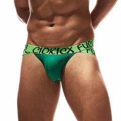 a hot gay man in green Rebel Jockstrap - pridevoyageshop.com - gay men’s underwear and swimwear