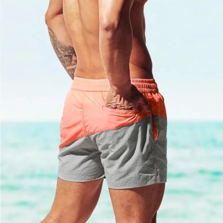 a hot guy in orange Tidal Charm Two Toned Board Shorts - pridevoyageshop.com - gay men’s underwear and swimwear