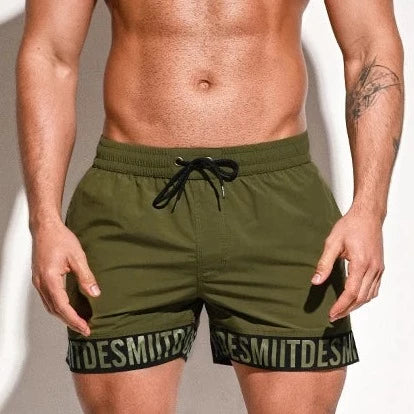 a hot man in army green Desmiit Scripted Tide Board Shorts - pridevoyageshop.com - gay men’s underwear and swimwear