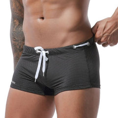hot gay man in black Gay Swimwear & Beachwear | Men's Bowtie Tight Swim Trunks - pridevoyageshop.com - gay men’s underwear and swimwear