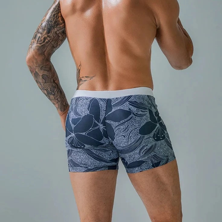 a hot gay man in light blue Wild Island Flirt Swim Trunks - pridevoyageshop.com - gay men’s underwear and swimwear