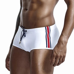 a hot gay man in white Bold Stripe Swim Trunks - pridevoyageshop.com - gay men’s underwear and swimwear