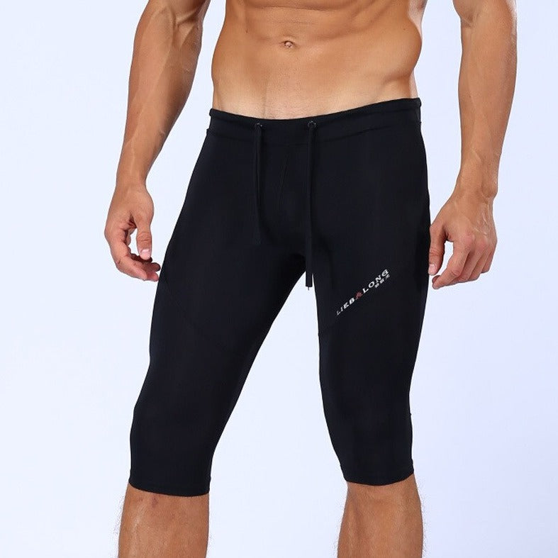 sexy gay man in black Gay Leggings | Men's Sexy 3/4 Compression Sport Leggings - pridevoyageshop.com - gay men’s underwear and activewear