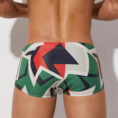 a hot gay man in Men's Mod Geo Swim Trunks - pridevoyageshop.com - gay men’s underwear and swimwear