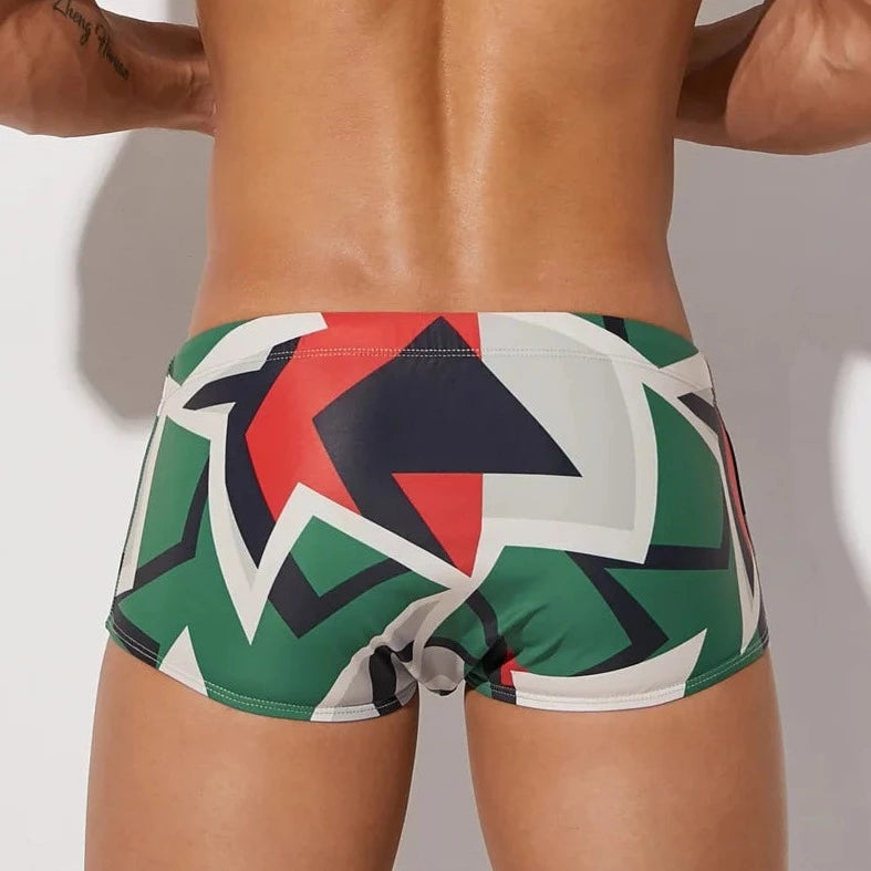 a hot gay man in Men's Mod Geo Swim Trunks - pridevoyageshop.com - gay men’s underwear and swimwear