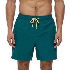 a hot gay man in dark green Solid Color Pocketed Board Shorts - pridevoyageshop.com - gay men’s underwear and swimwear