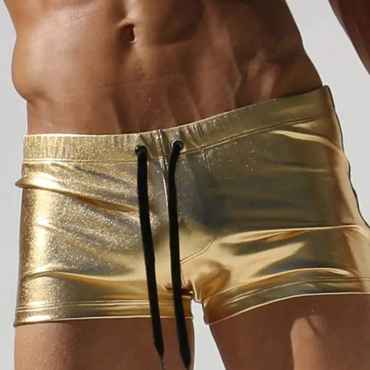 a sexy gay man in gold Men's Liquid Metallic Swim Trunks - pridevoyageshop.com - gay men’s underwear and swimwear