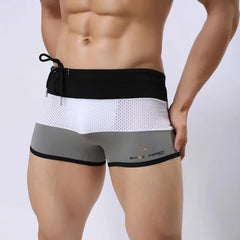 a hot gay man in Grey + White + Black Men's Tricolor Mesh Swim Trunks - pridevoyageshop.com - gay men’s underwear and swimwear