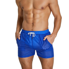 sexy gay man in blue Gay Beachwear | Men's Transparent Board Shorts with Pockets - pridevoyageshop.com - gay men’s underwear and swimwear