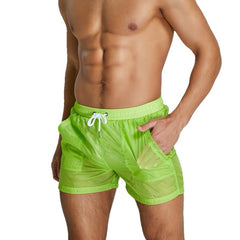 sexy gay man in green Gay Beachwear | Men's Transparent Board Shorts with Pockets - pridevoyageshop.com - gay men’s underwear and swimwear