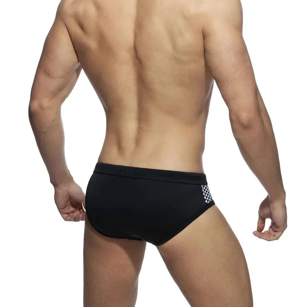 a sexy gay man in black Monochrome Matrix Swim Briefs - pridevoyageshop.com - gay men’s underwear and swimwear