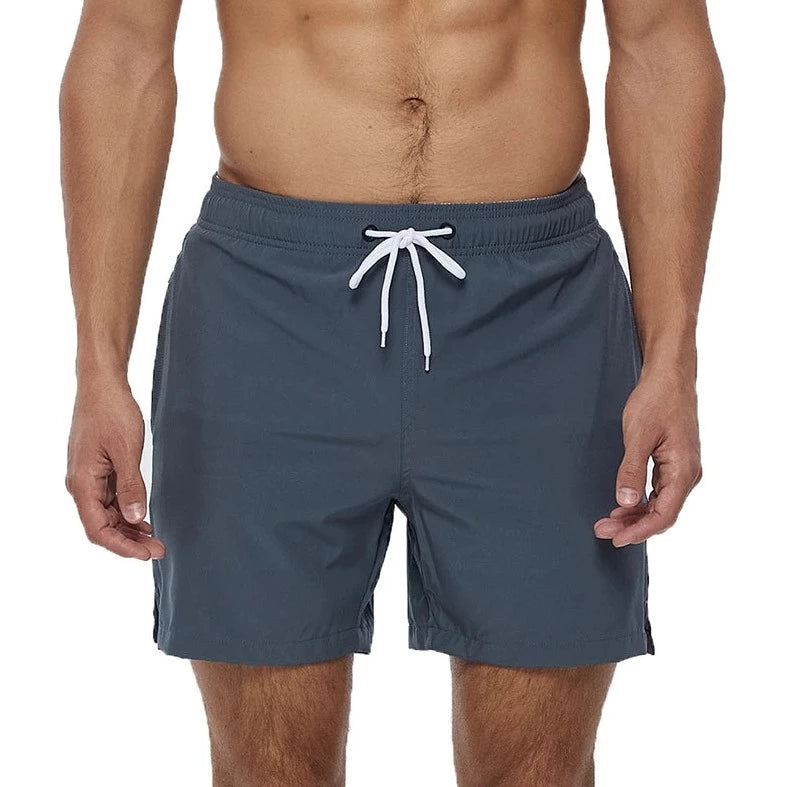 a hot gay man in gray Solid Color Pocketed Board Shorts - pridevoyageshop.com - gay men’s underwear and swimwear