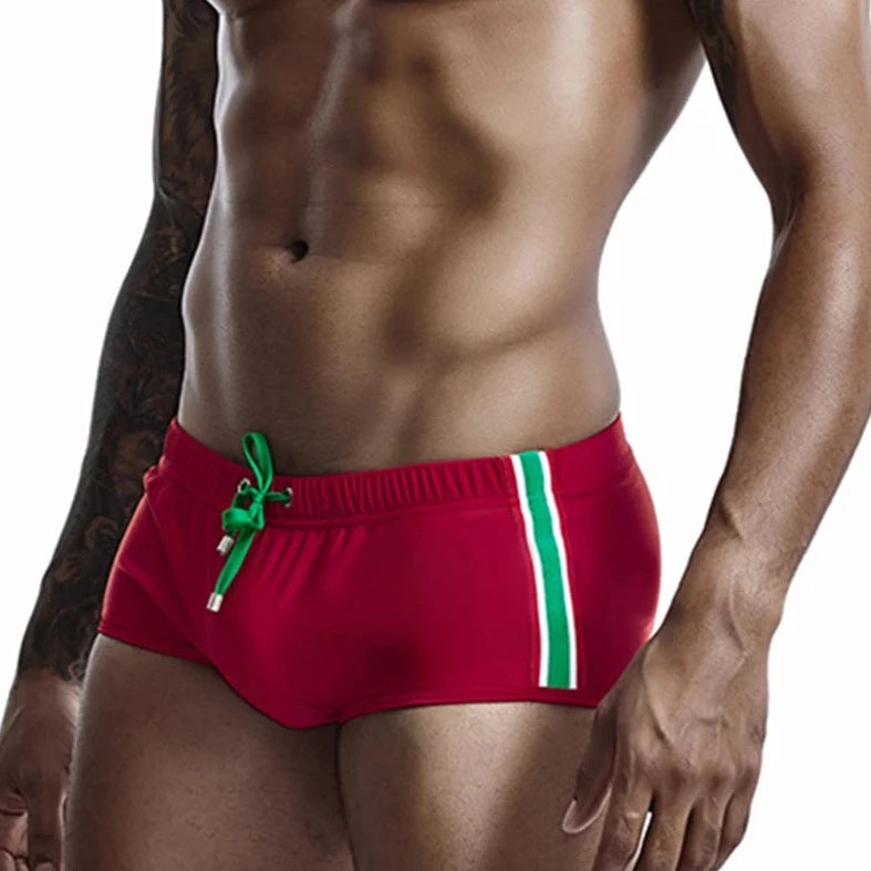 a hot gay man in red Bold Stripe Swim Trunks - pridevoyageshop.com - gay men’s underwear and swimwear
